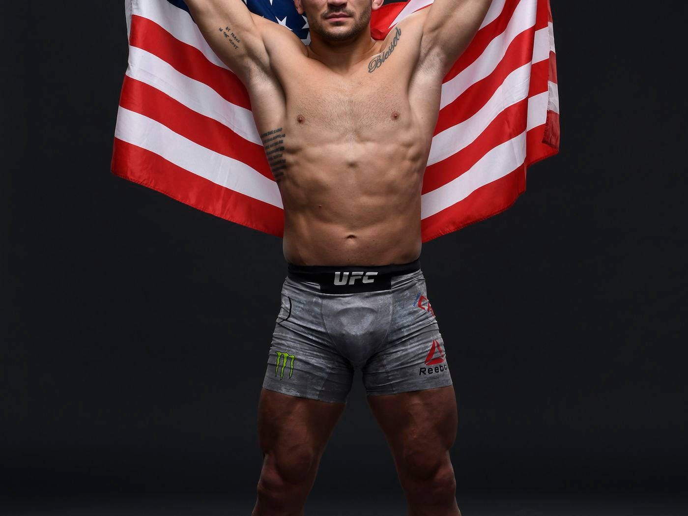 Michael Chandler Holding Up American Flag Background