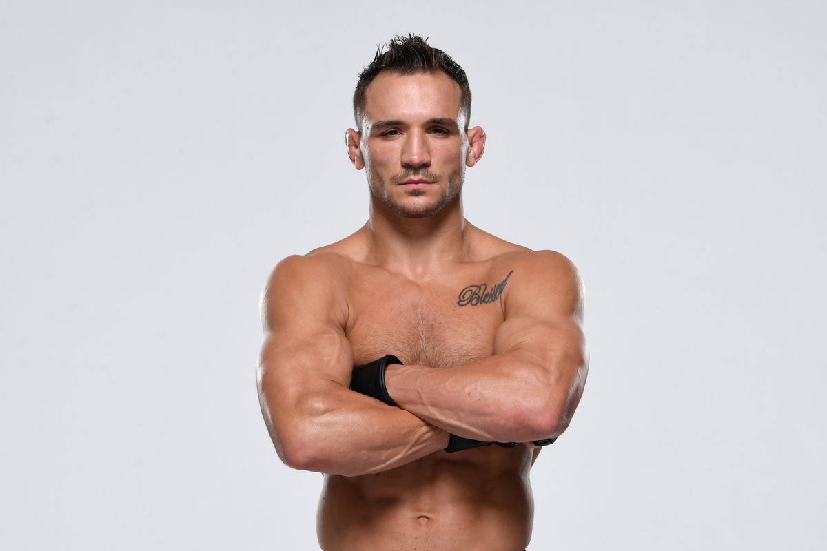 Michael Chandler With Crossed Arms Background