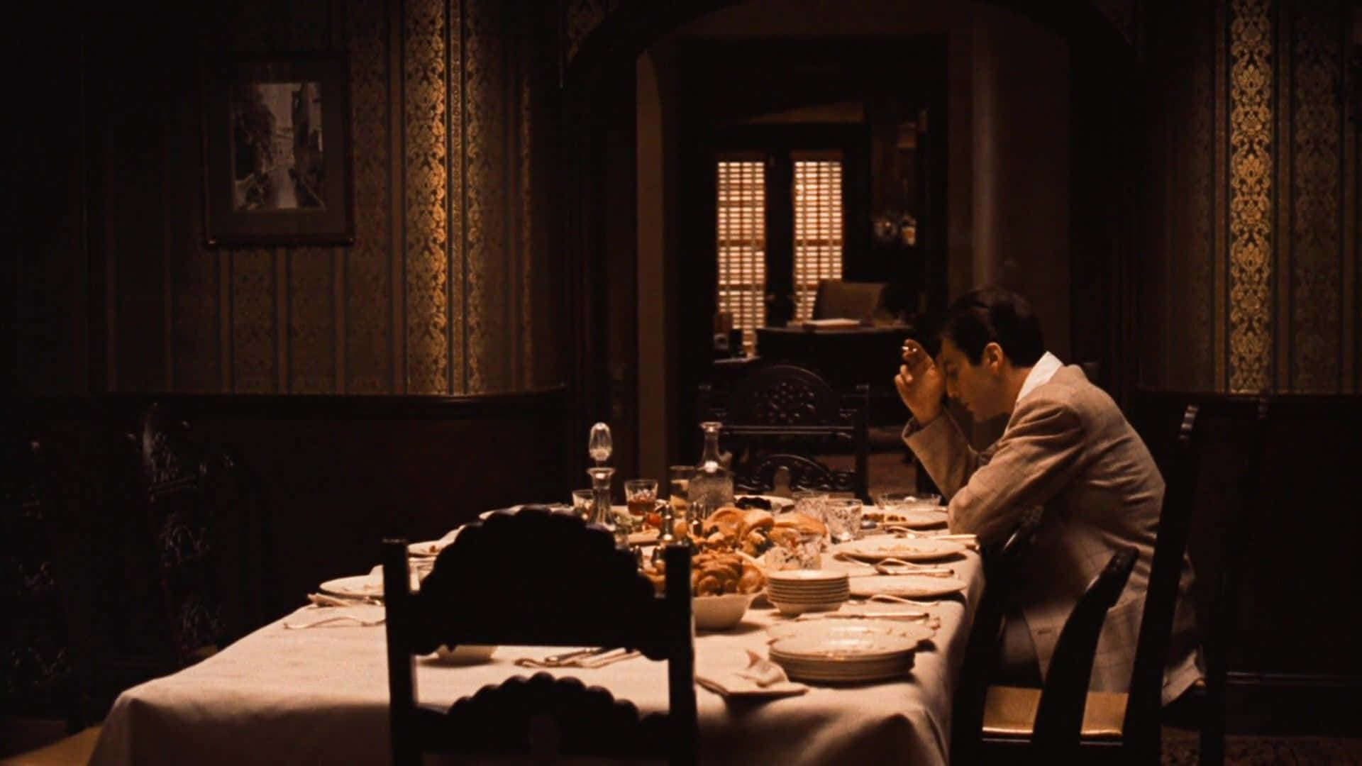 Michael Corleone Alone At The Table Background