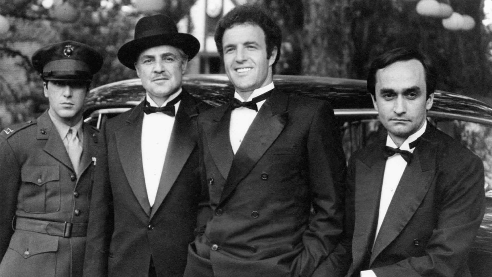 Michael Corleone With His Father And Brothers Background