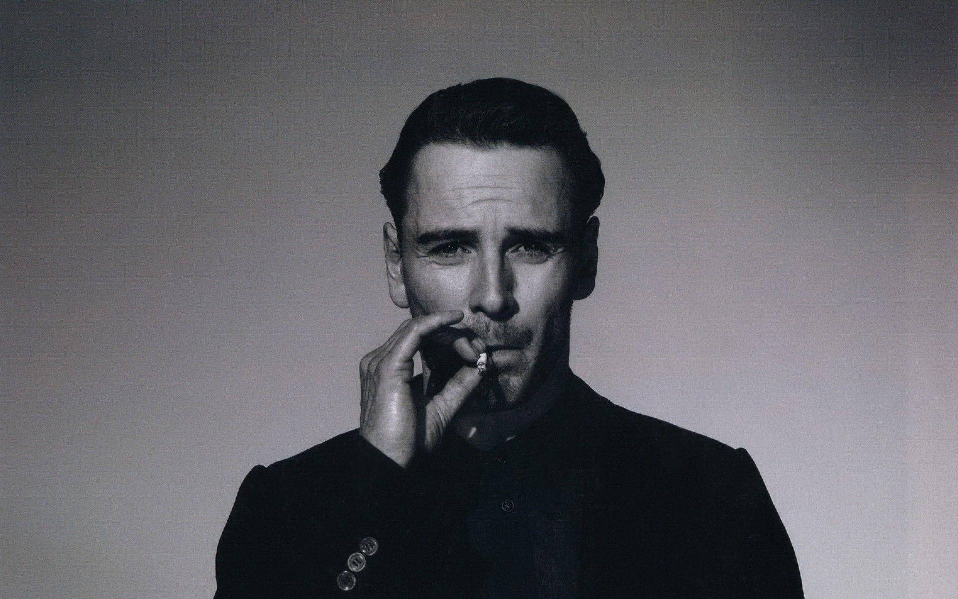 Michael Fassbender Smoking A Cigarette Background