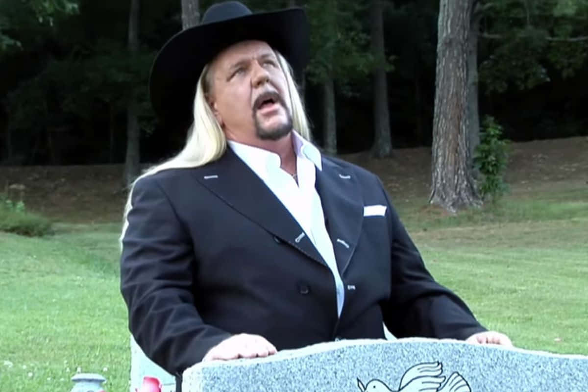 Michael Hayes Talking At A Funeral Background