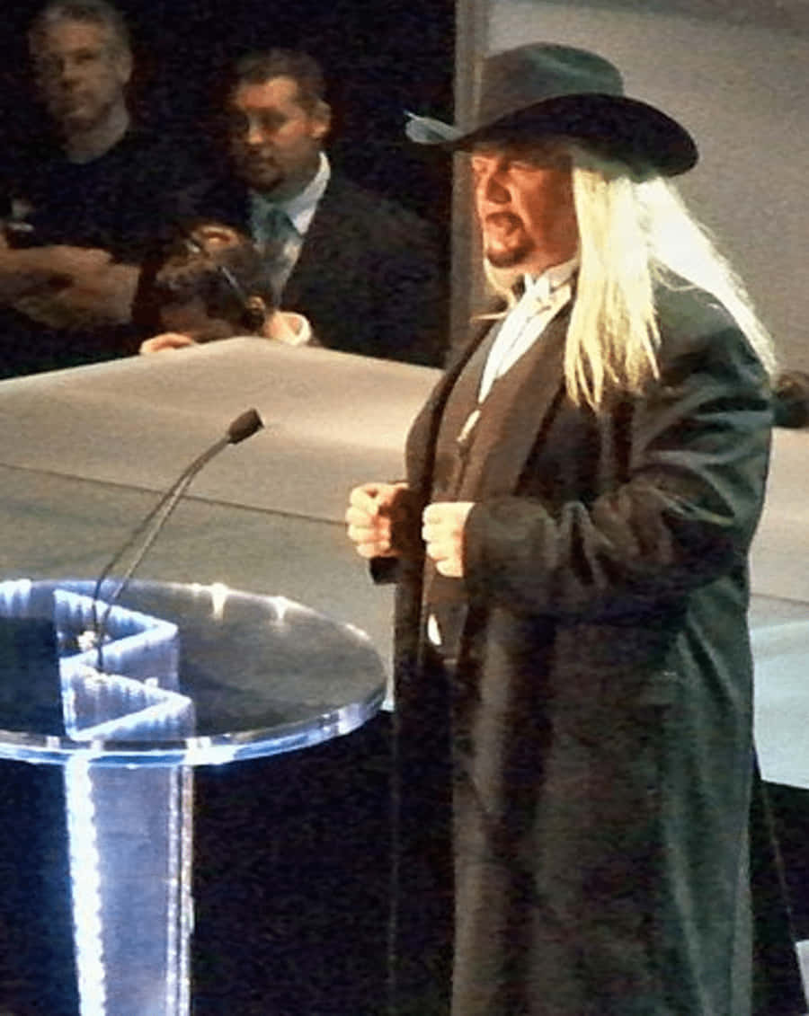 Michael Hayes Wearing Cowboy Hat Background