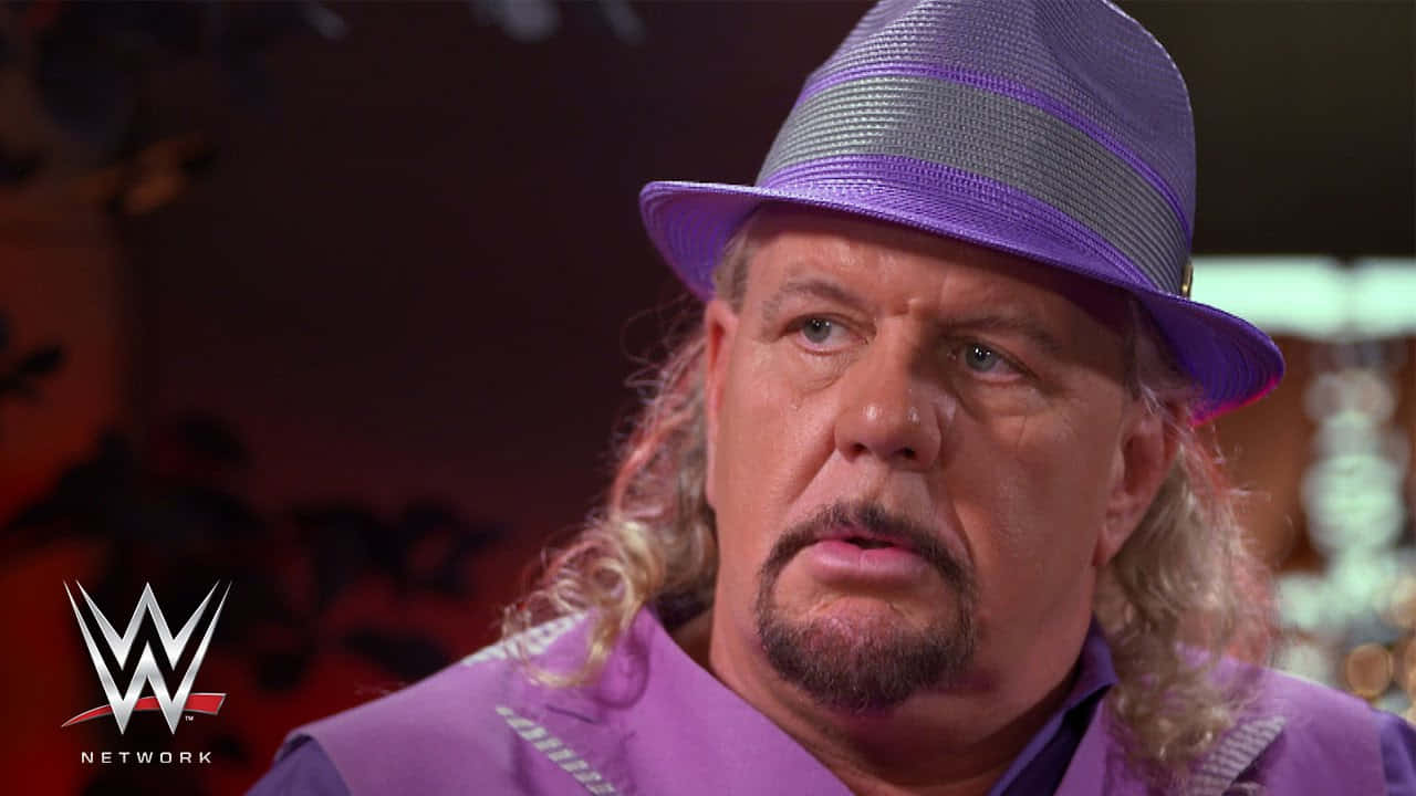 Michael Hayes Wearing Purple Fedora Background