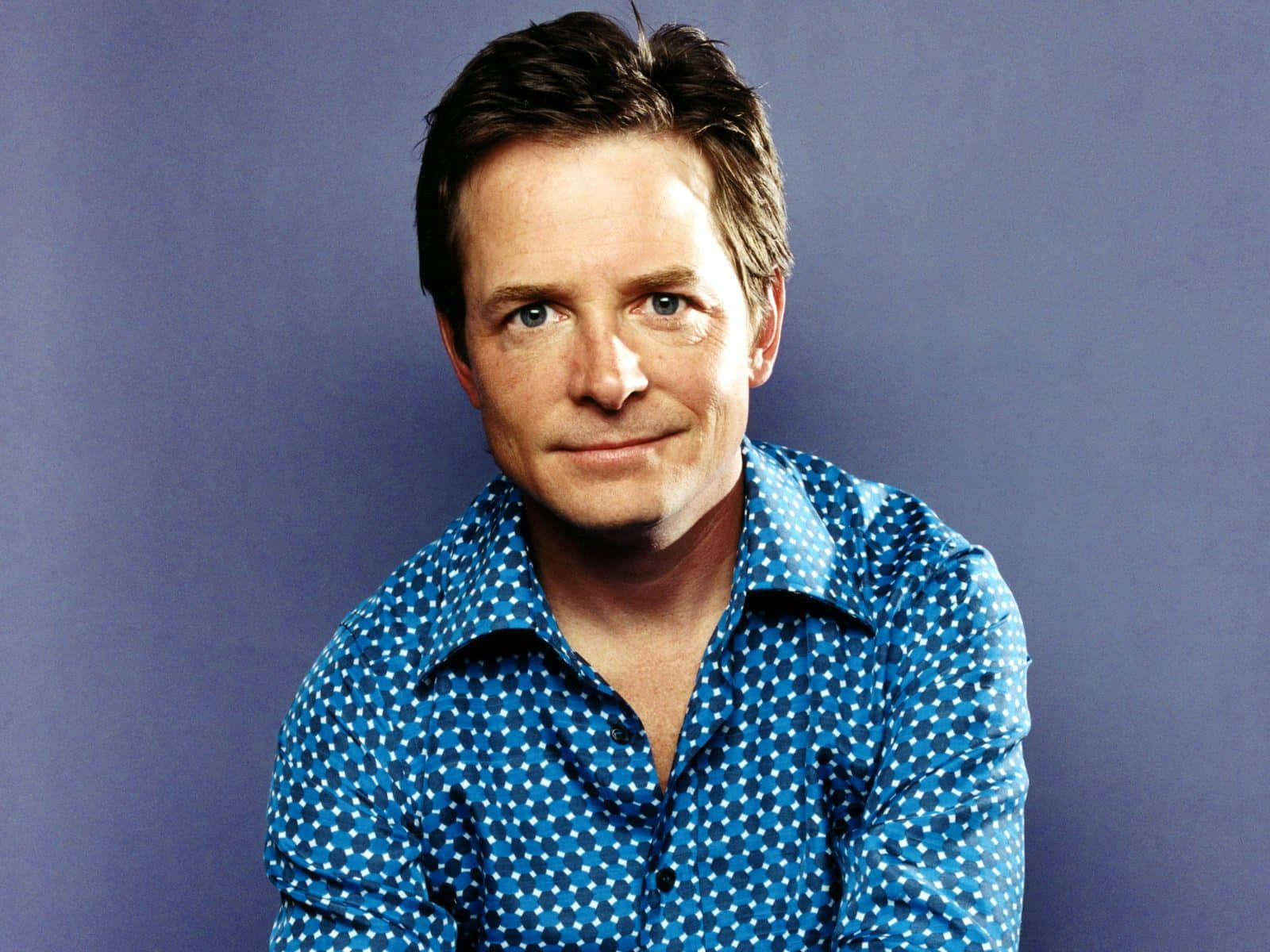 Michael J Fox In His Iconic Role As Marty Mcfly Background