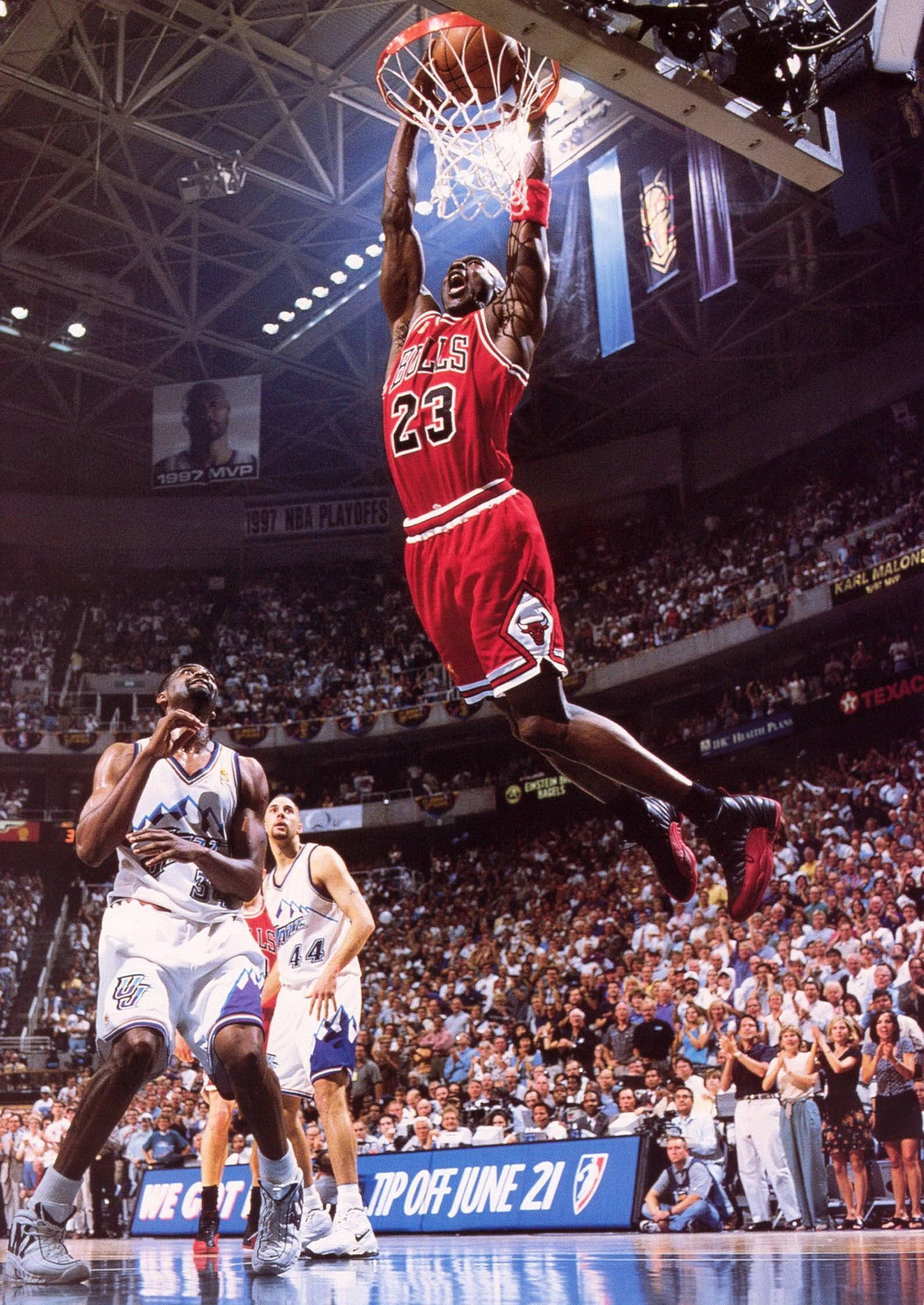 Michael Jordan Flies Through The Air Making A Legendary Dunk Background