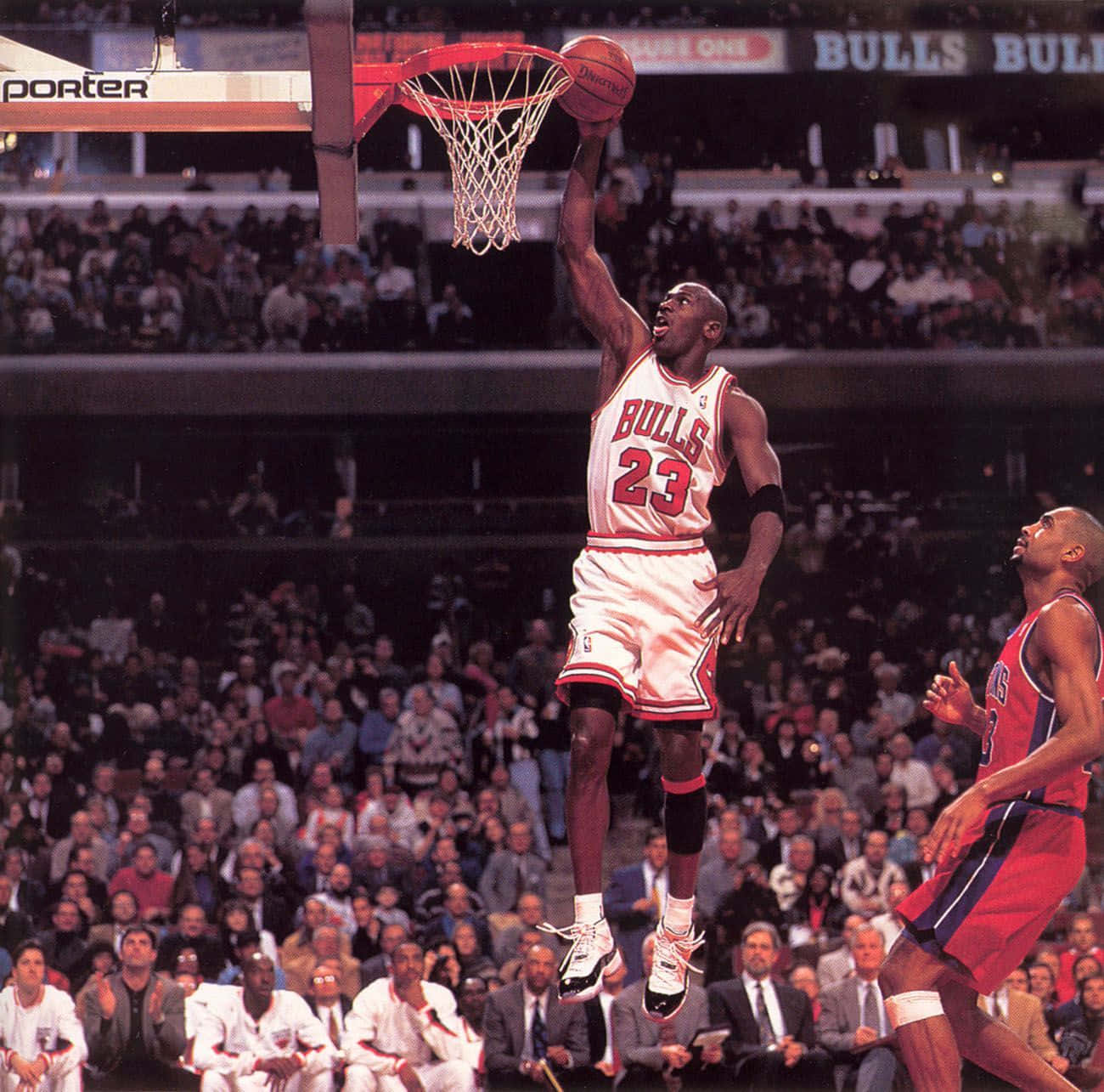 Michael Jordan Glides Through Air For An Epic Dunk Background