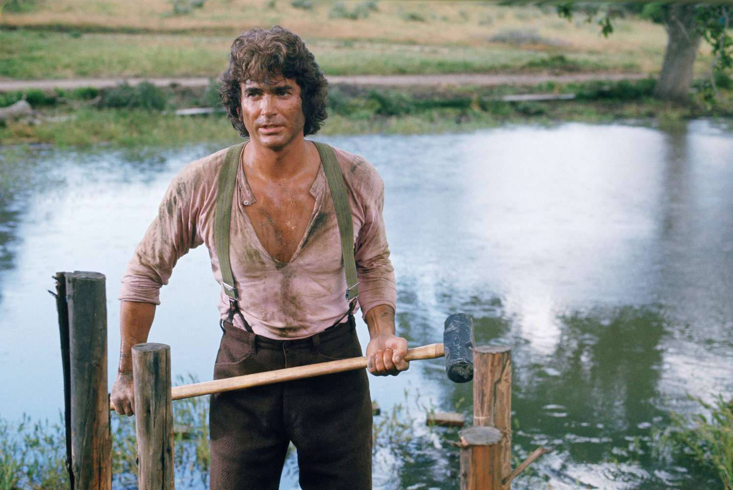 Michael Landon As Charles Ingalls Portraying Intensity And Resilience Background