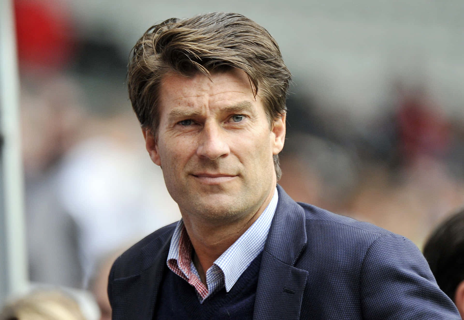 Michael Laudrup Entering Event Venue Background