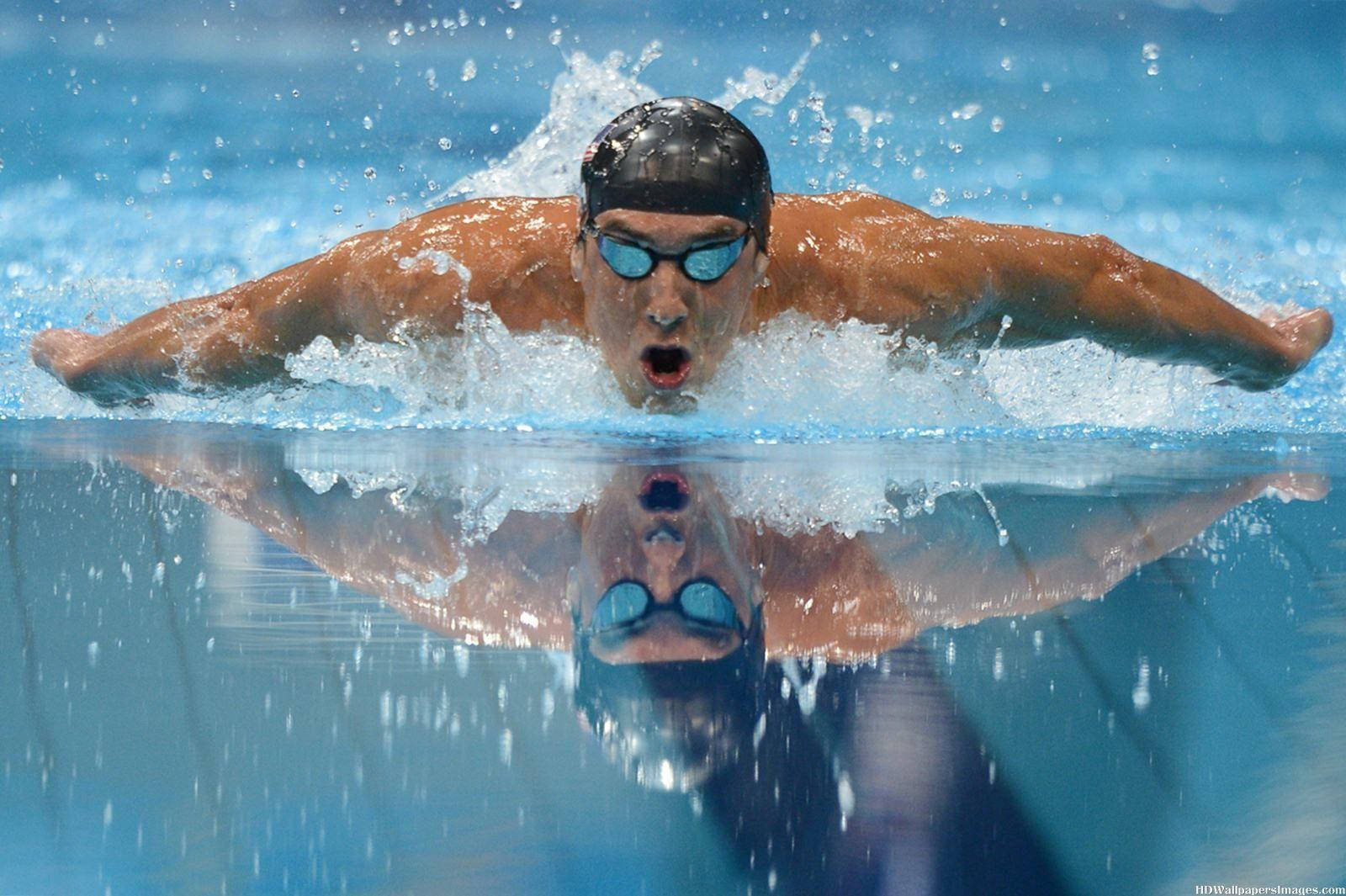 Michael Phelps, The Olympic Legend, Performing A Dive Background