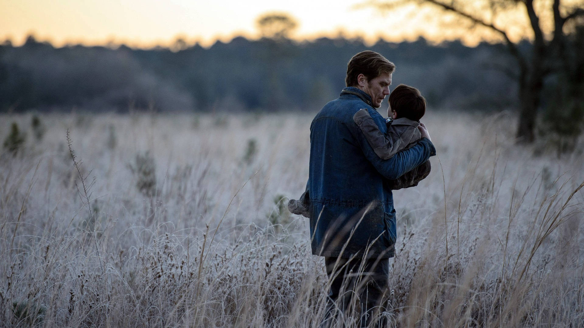 Michael Shannon With Kid On Grassland