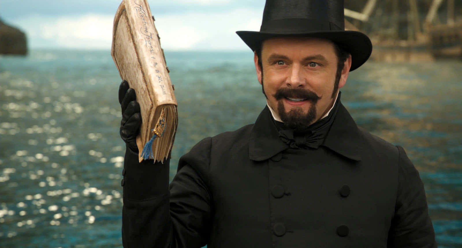 Michael Sheen Looking Up In Awe Background