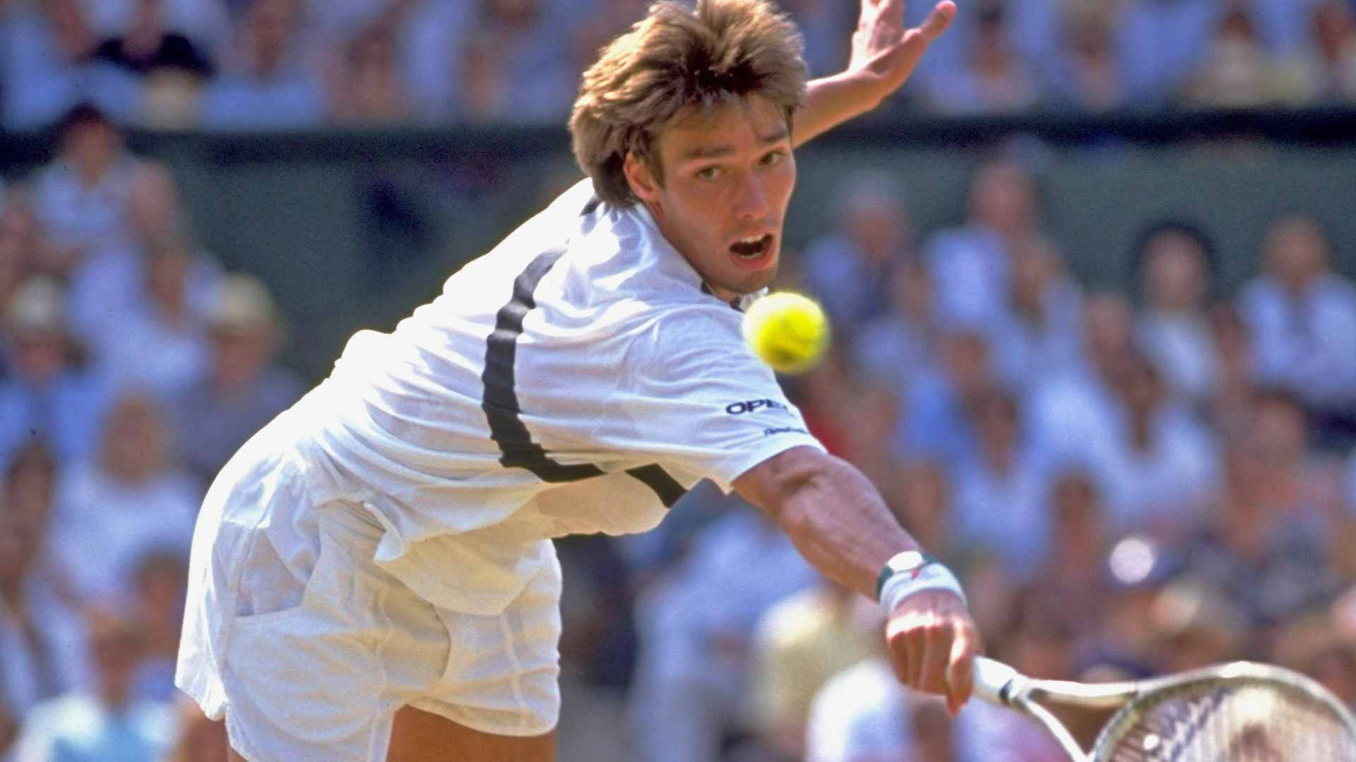 Michael Stich Fiercely Chasing A Ball During A Tennis Match Background