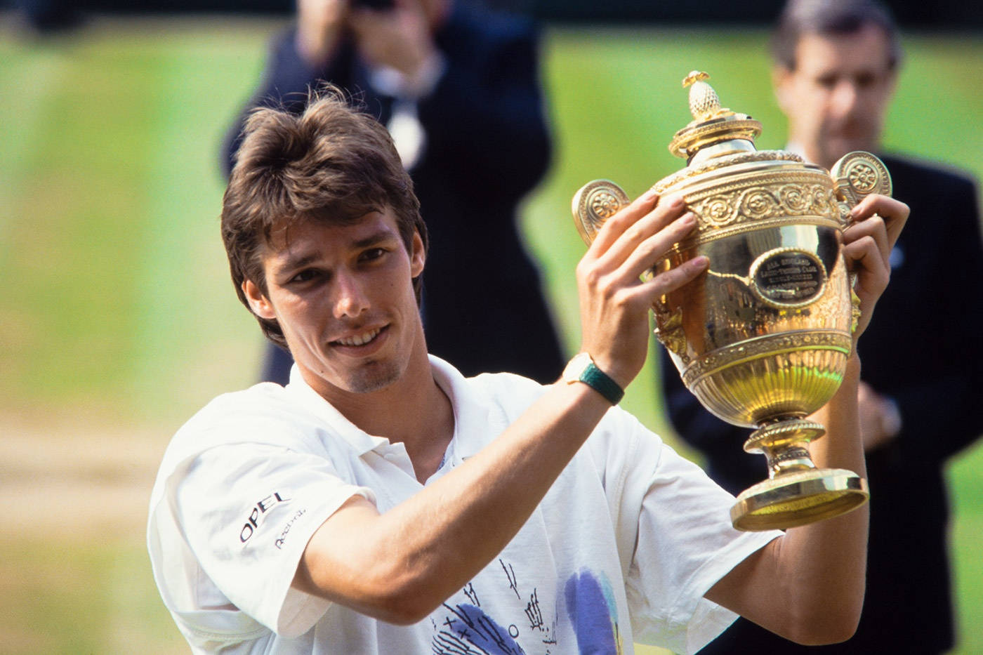 Michael Stich Holding A Trophy Background