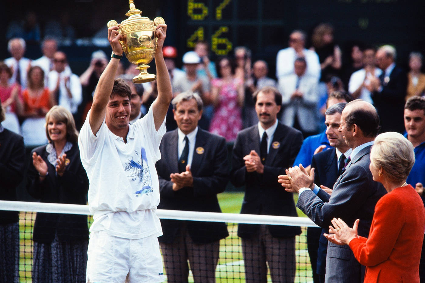 Michael Stich Holding Trophy Over Head Background