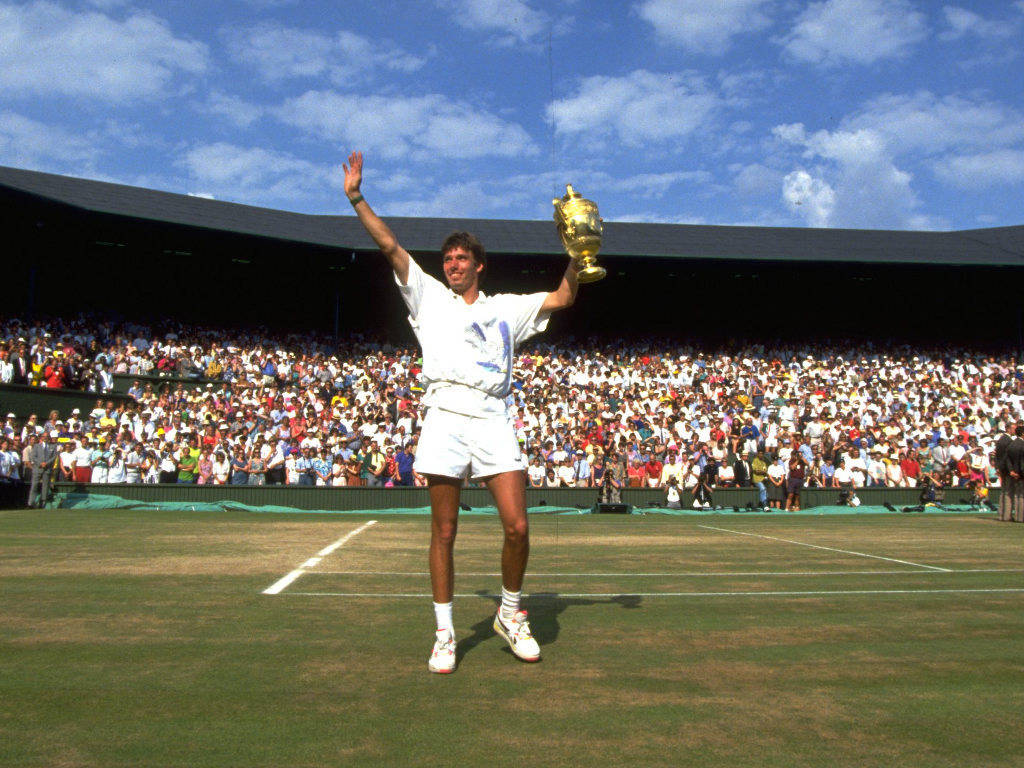 Michael Stich Posing With Trophy Background