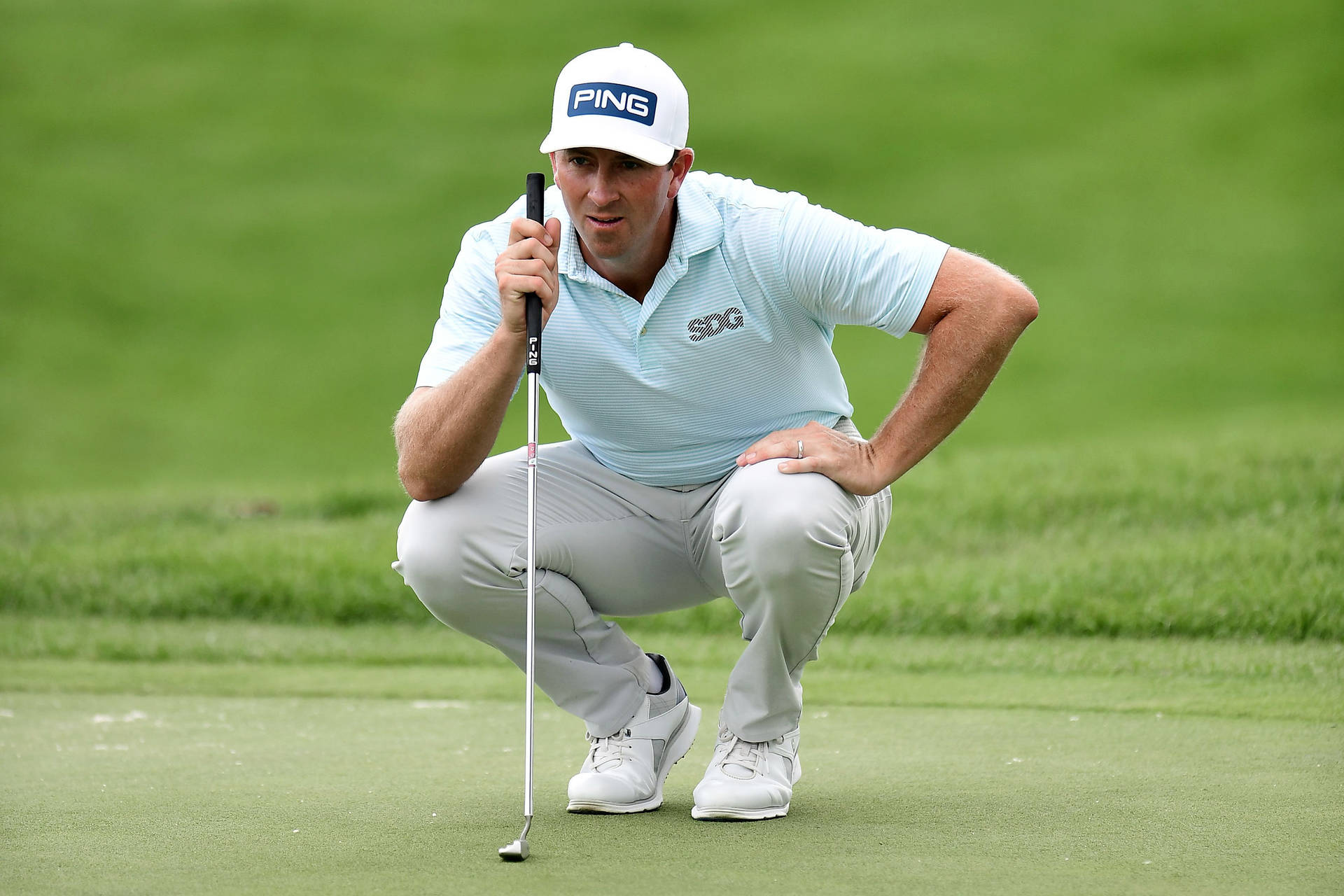 Michael Thompson Sitting On Golf Course Background