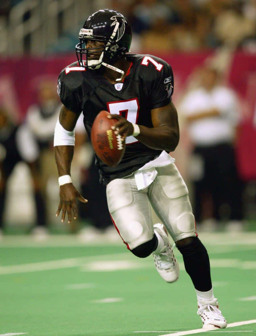 Michael Vick In Action During The 2004 Nfl Season Background