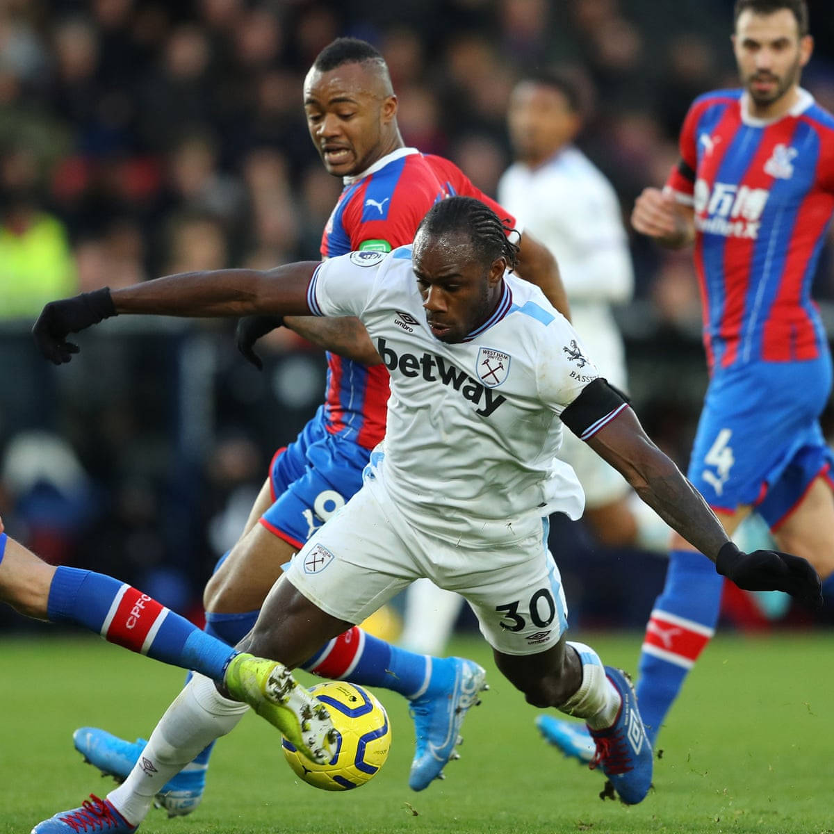 Michail Antonio Defending Yellow Ball Background