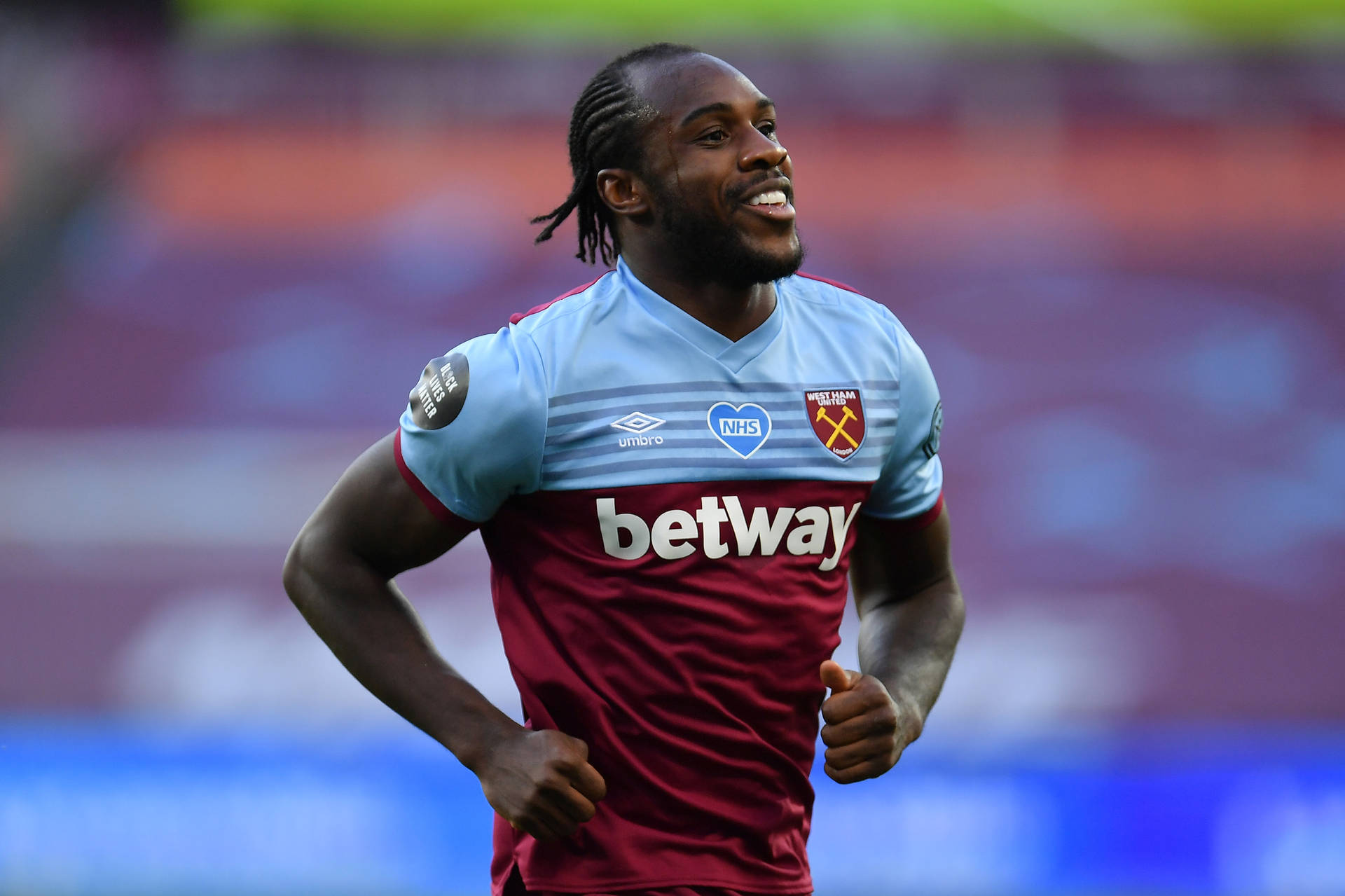 Michail Antonio Running On Pitch Background