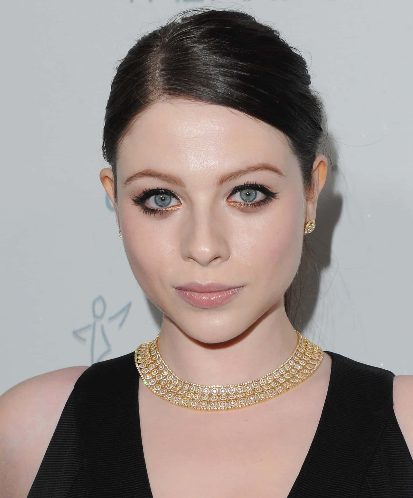 Michelle Trachtenberg Striking A Pose In A Stylish Outfit Background