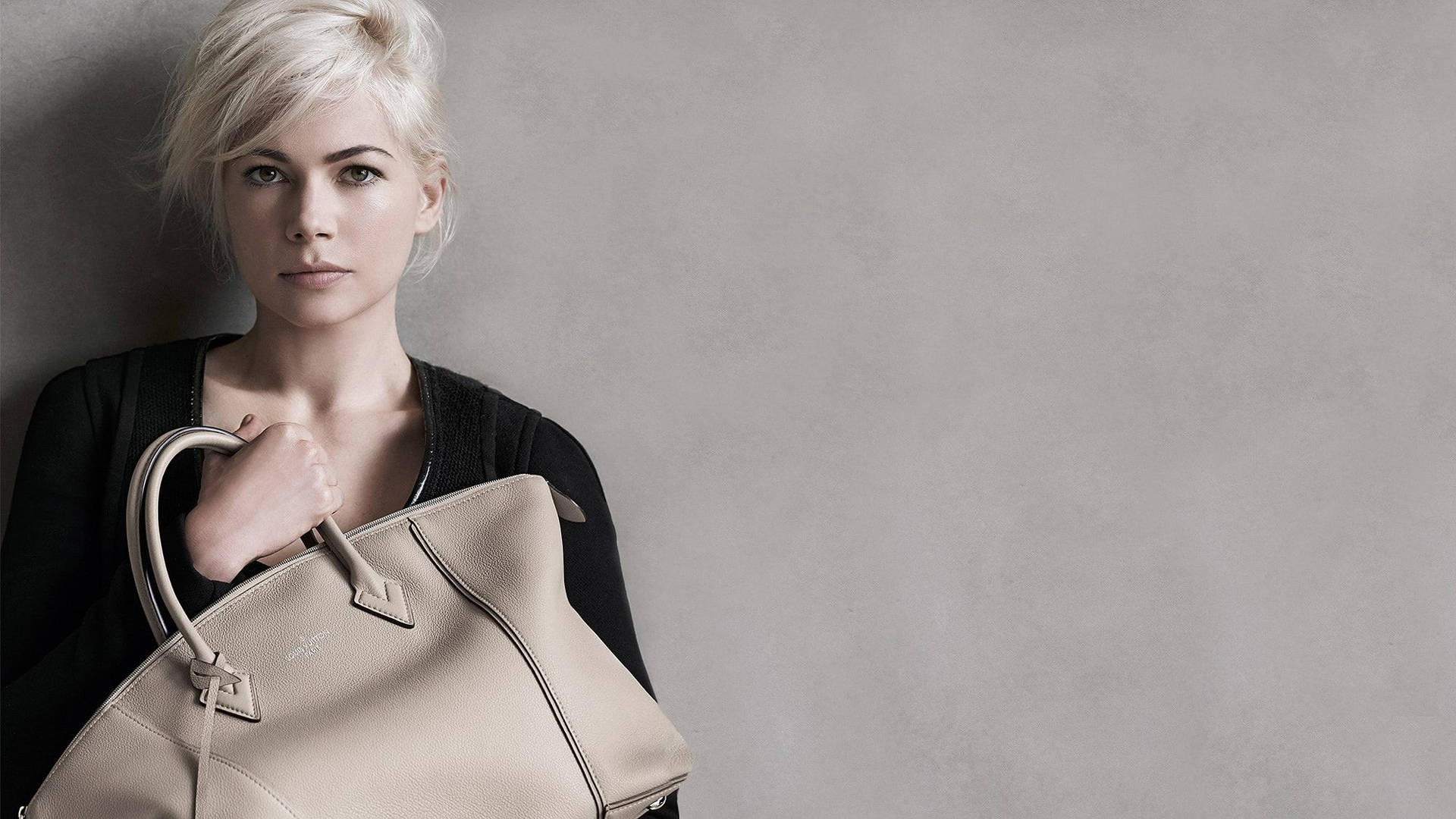 Michelle Williams Holding Louis Vuitton Bag