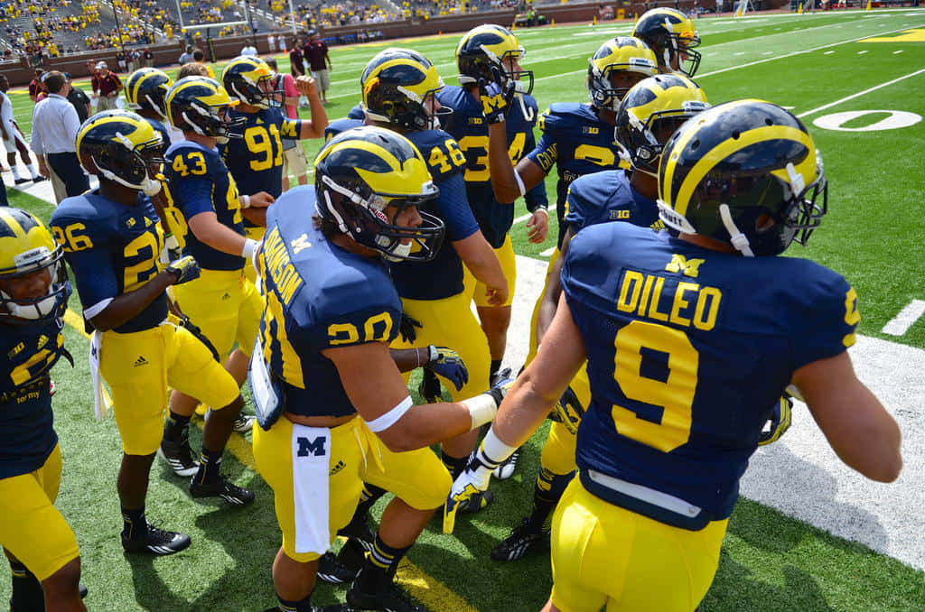 Michigan Wolverines Are Ready To Take On The Field Background