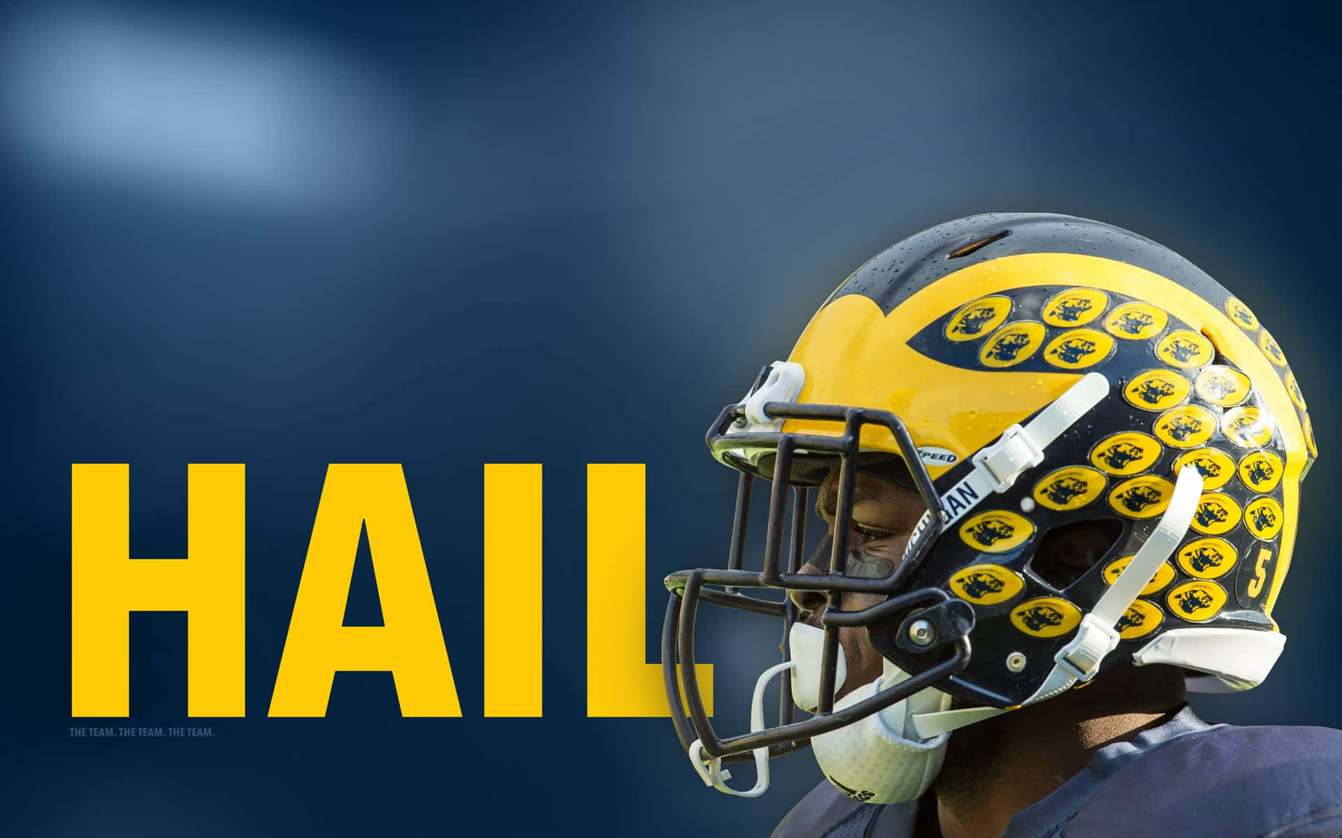 Michigan Wolverines Football Player In Helmet Background