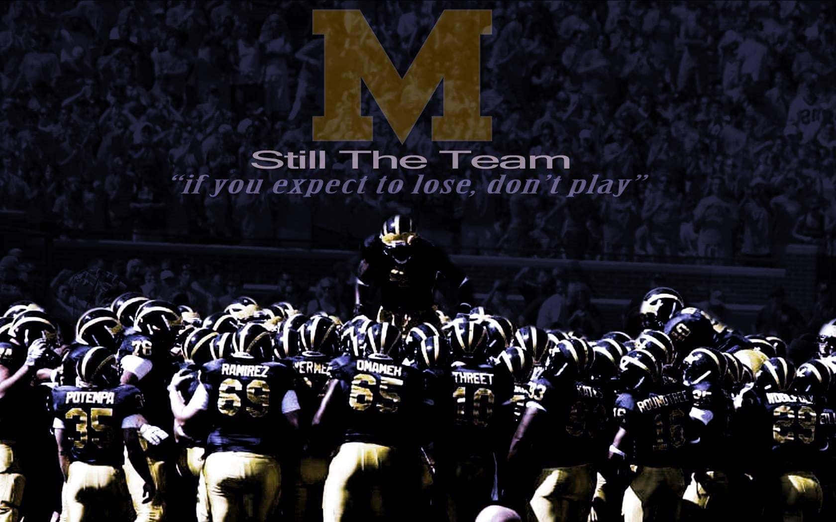 Michigan Wolverines Football Team Charging On The Field Background