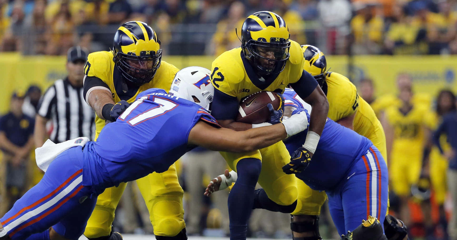 Michigan Wolverines Football Team Fire Up Ann Arbor Background