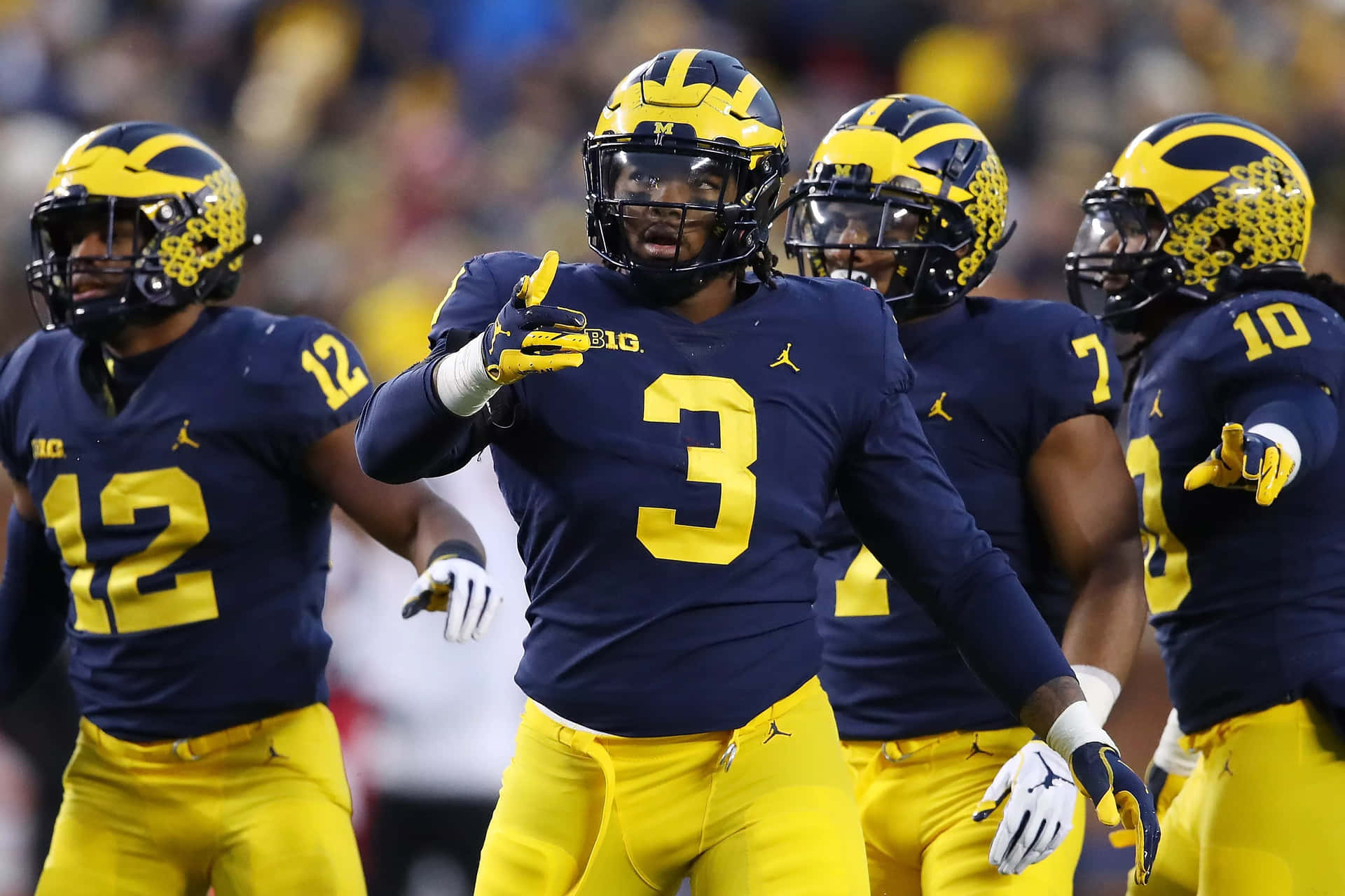 Michigan Wolverines Football Team On The Field Background