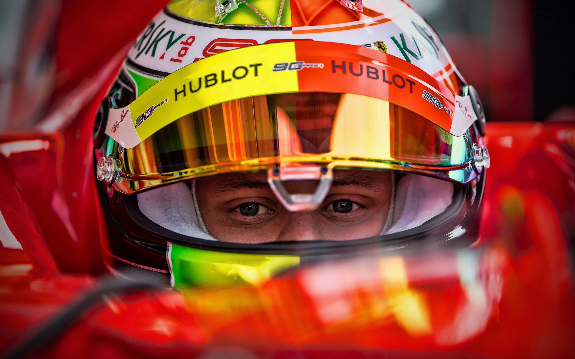 Mick Schumacher Close-up With Helmet Background