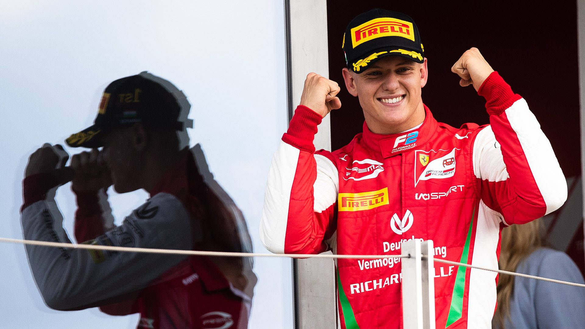 Mick Schumacher Raised Fists Background