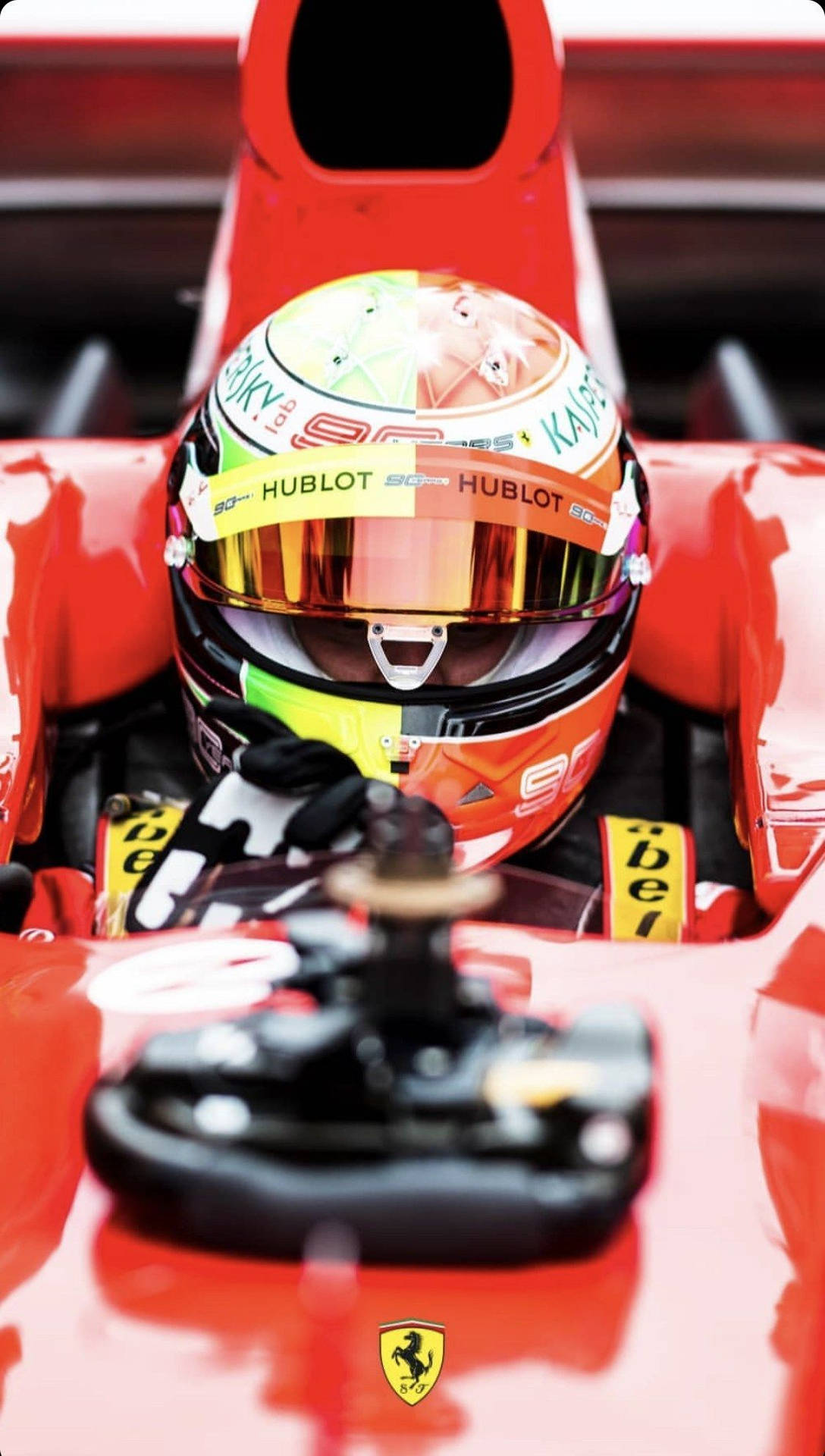 Mick Schumacher Riding Red Car Background