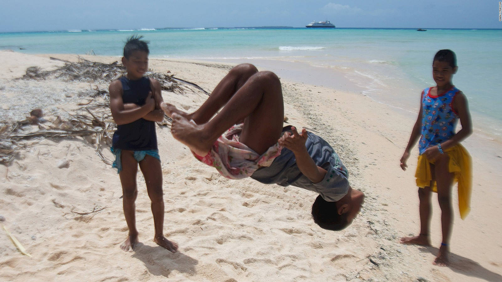 Micronesia Boy Doing Backflip Background