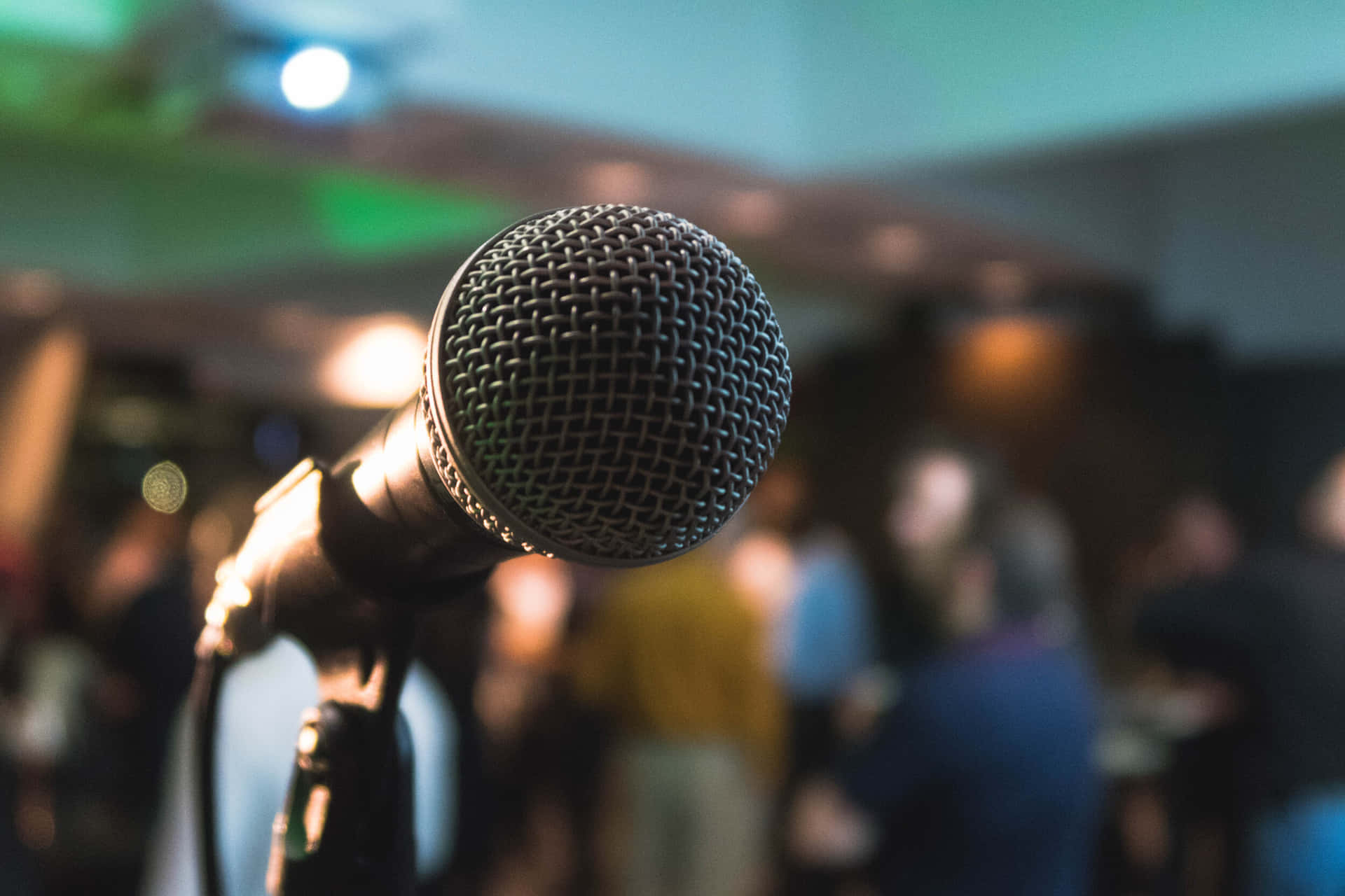 Microphone In Front Of A Crowd Background