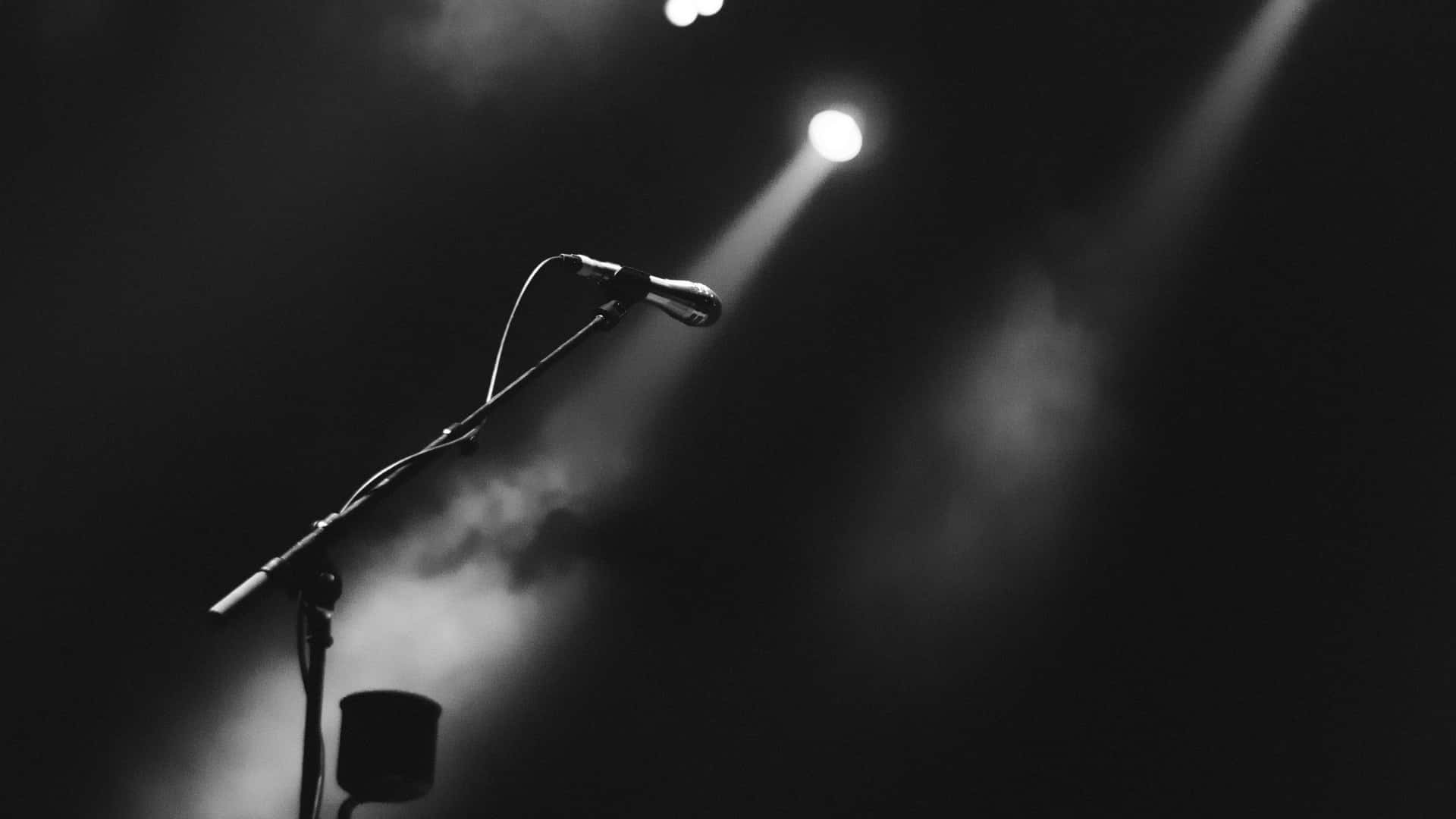 Microphone In The Spotlight In Black And White Background