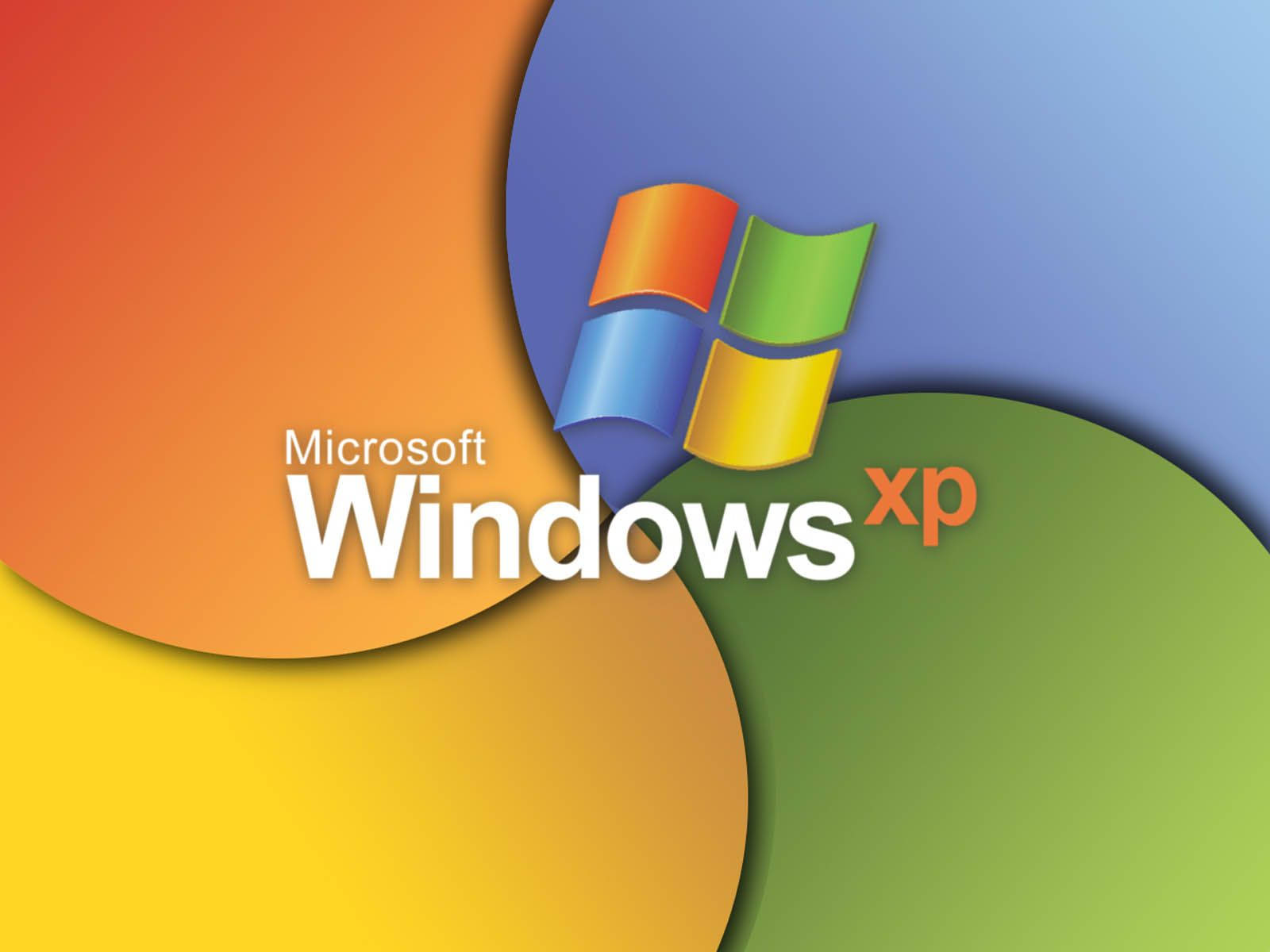 Microsoft Windows Xp Logo With Colorful Circles Background