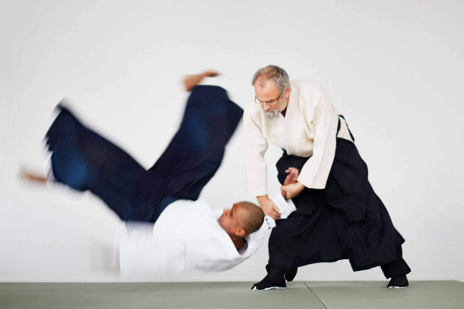 Mid Action Koshi Nage Aikido Technique Background