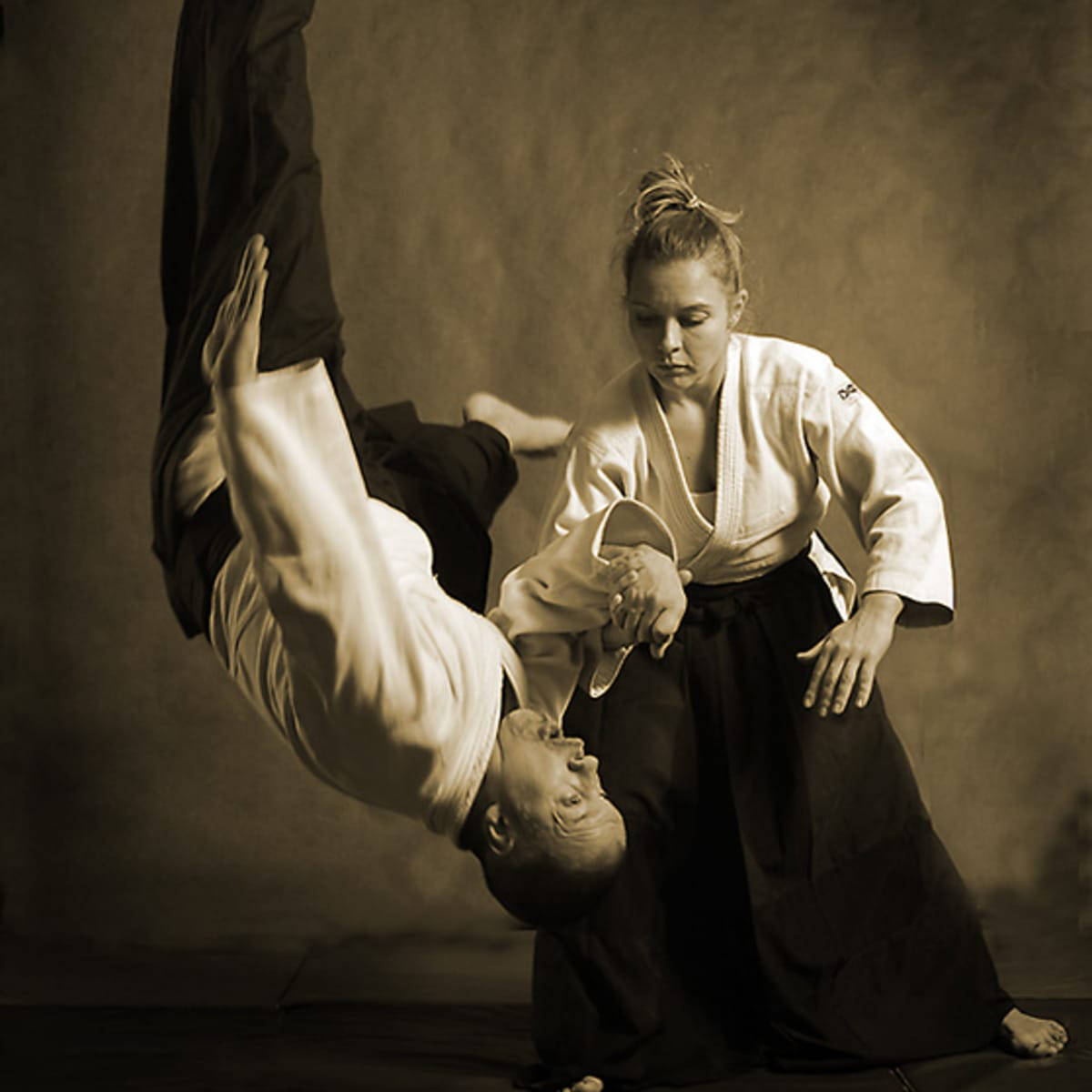 Mid Action Koshi Nage In Sepia Tone Background