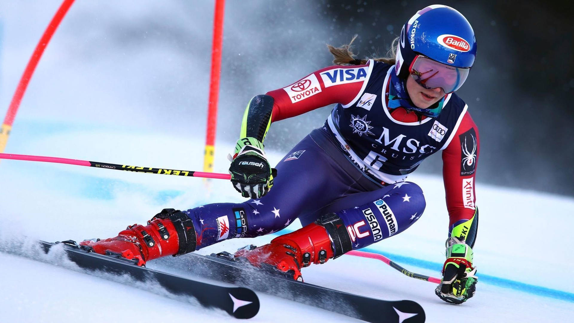 Mikaela Shiffrin In Downhill Alpine Skiing Action Background