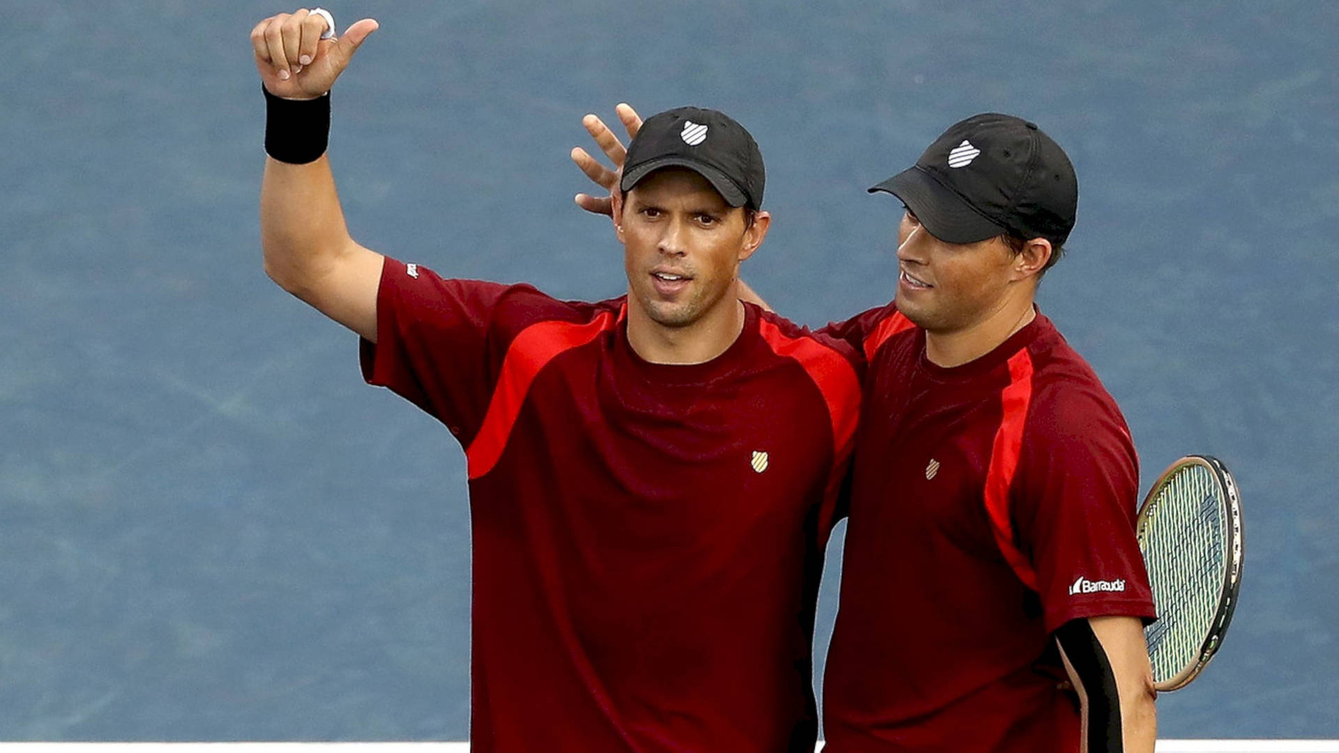 Mike And Bob Bryan Red Outfits Background