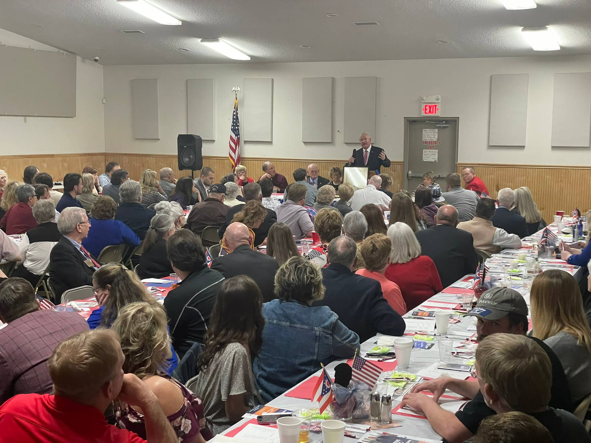 Mike Gibbons Delivering Speech In Packed Room