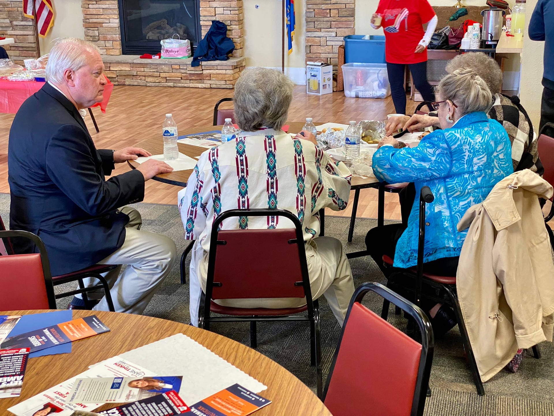 Mike Gibbons Sitting With Senior Citizens