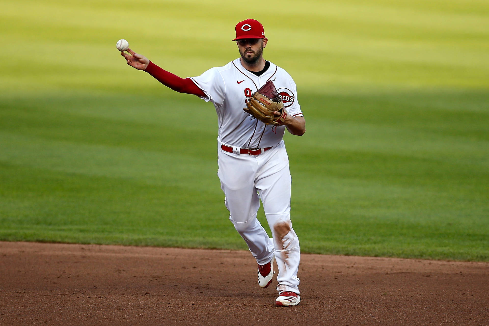 Mike Moustakas Carrying The Ball Background