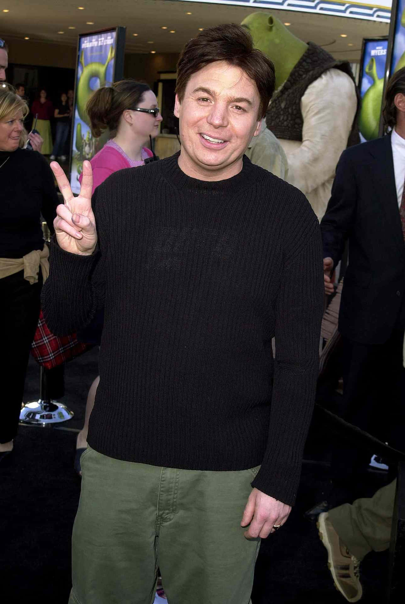 Mike Myers Striking A Charismatic Pose Background