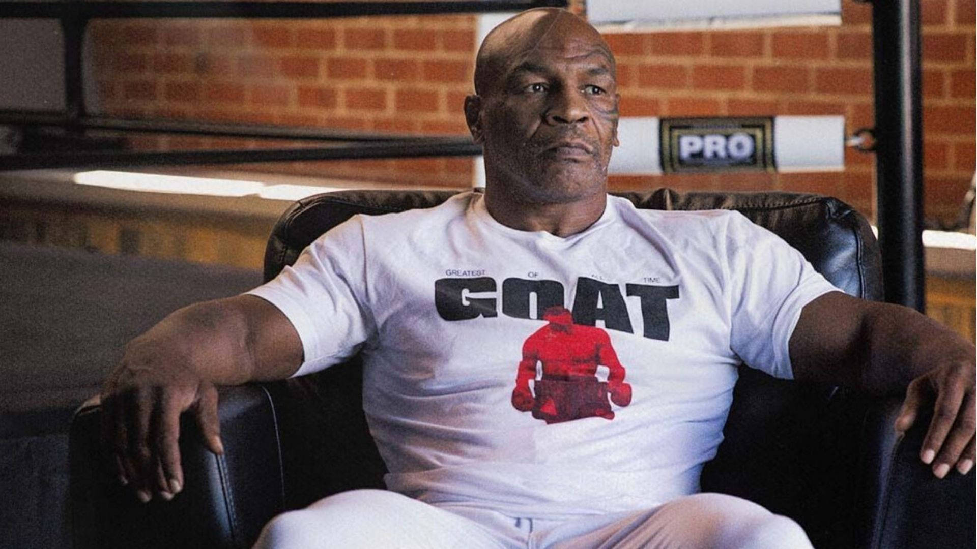 Mike Tyson On A Couch Background