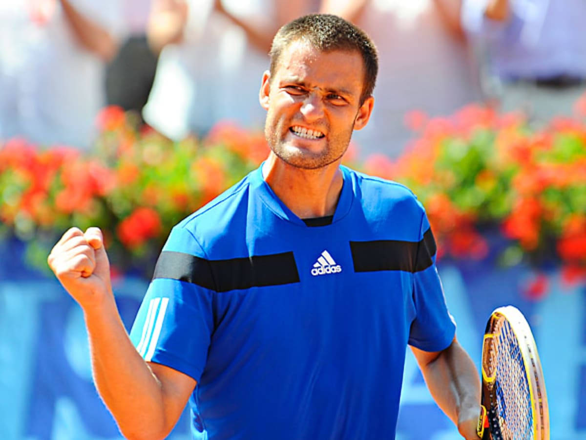 Mikhail Youzhny Celebrating With A Fist Pump Background