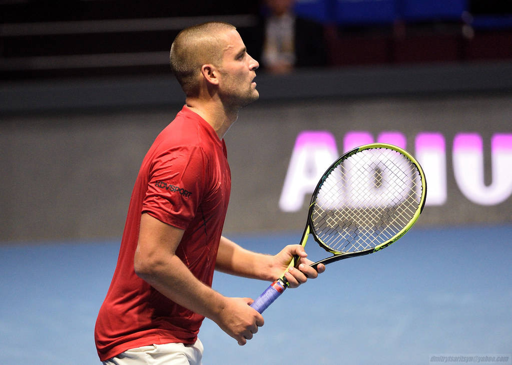 Mikhail Youzhny Gripping Tennis Racket Background