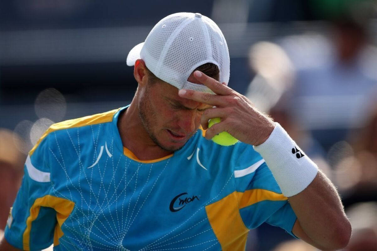 Mikhail Youzhny Holding His Head Background